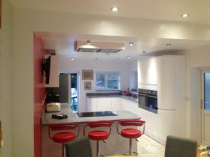 White Curved Gloss Handleless Kitchen with Thin Grey Worktops 2
