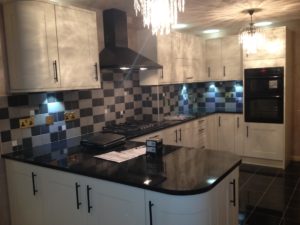 White Curved Kitchen Black Worktops